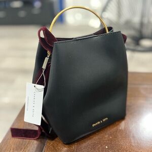 Charles & Keith Black Bucket Bag with Gold and Red Velvet Accent